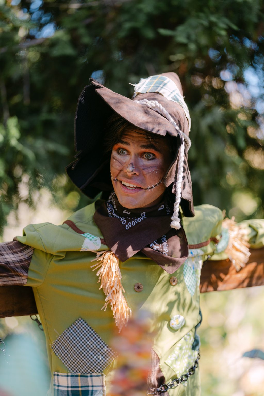 The Scarecrow smiles in costume during Heart to Art Productions’ Fall Into Oz in Woodland Hills.