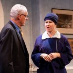 A detective questions a woman in a headscarf during The Group Rep’s Spider’s Web at the Lonny Chapman Theatre.