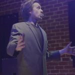 Adam Kroksh performs as the host of Veils of the Unknown, Write Act Repertory's Cringe Festival 2026 at the Brickhouse Theatre.