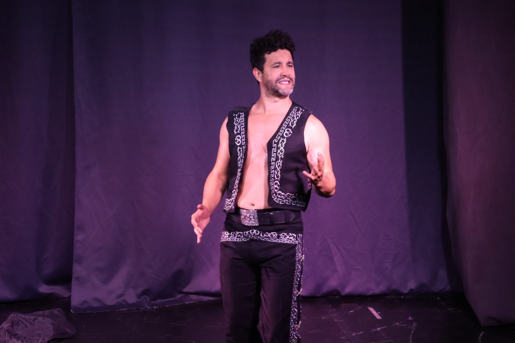 Eduardo Enrikez performs onstage in an open mariachi-style costume during The Last Song.