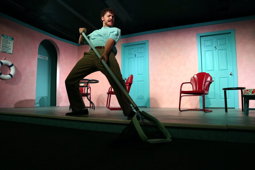 Jackson LaFluer dramatically wields a pool-cleaning pole in MOTEL 66 at The Group Rep.
