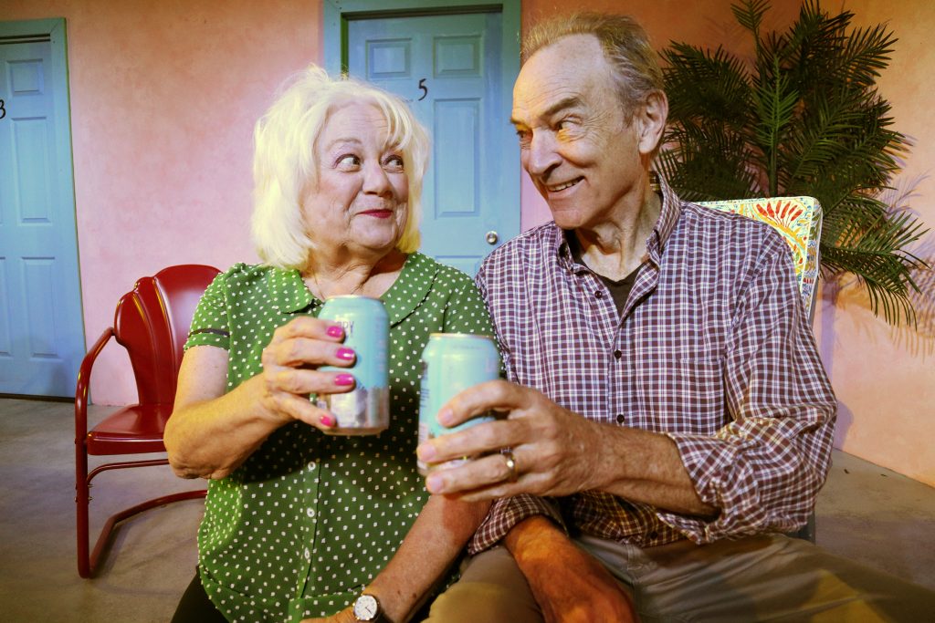 Judy Nazemetz and Lon Huber share a cheerful toast in MOTEL 66 at The Group Rep.
