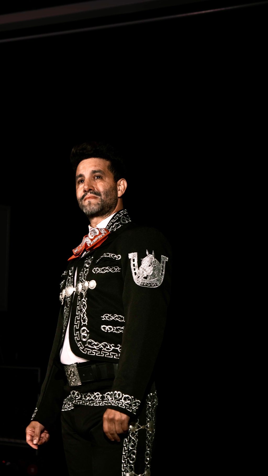 Eduardo Enrikez performs in traditional mariachi attire in The Last Song at Whitefire Theatre.