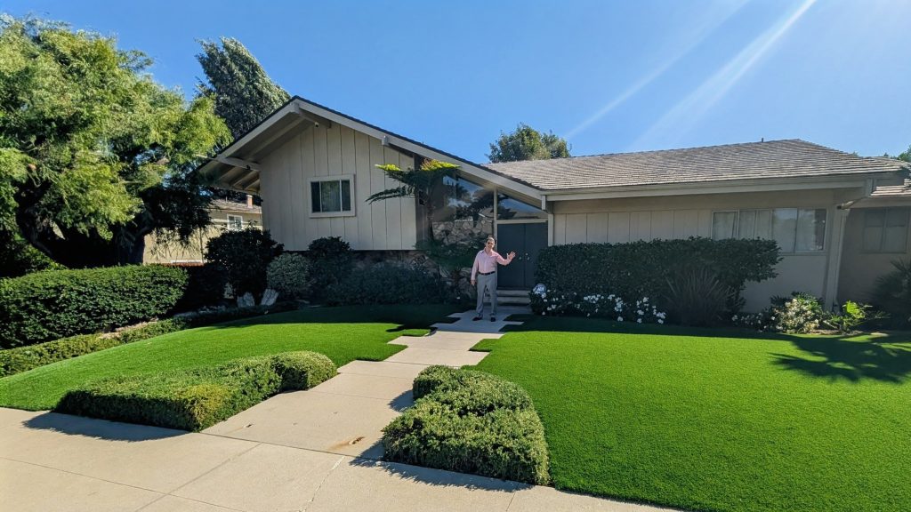 Jack Witt stands outside The Brady Bunch house in Studio City, the famous exterior featured in the 1970s television series.
