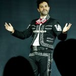 Eduardo Enrikez addresses the audience in traditional mariachi attire during The Last Song at Whitefire Theatre.